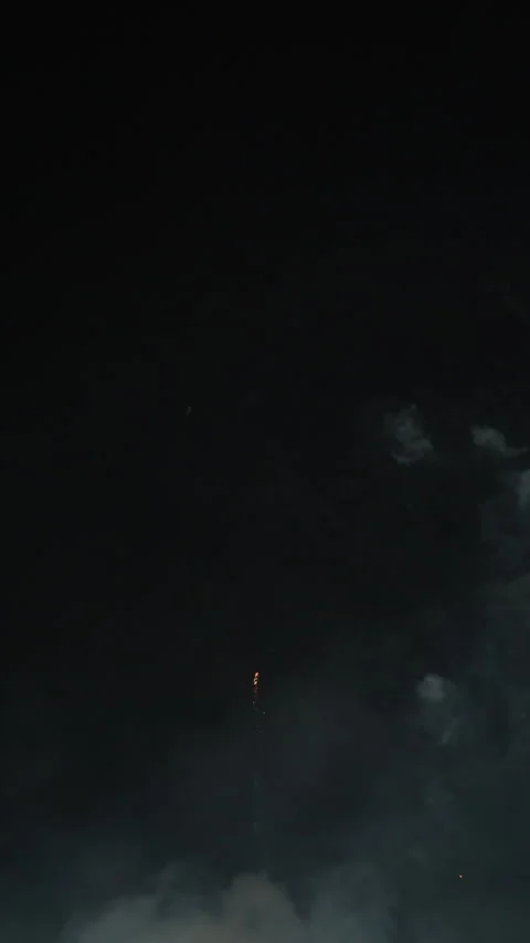 Single firework explosion with white and gold spark at night Stock Footage 334299818