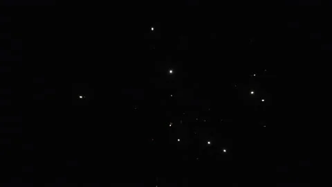 Single firework lights flash small lights in the night Stock Footage 130392659