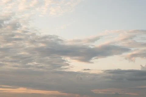 Single fluffy cloud in evening sky background Stock Photos