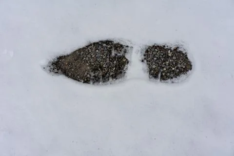Single footstep in snow Stock Photos