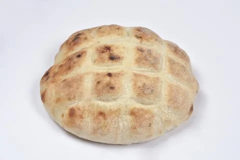 Single fresh flatbread on white background Foto stock