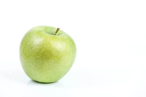 A single, fresh green apple with a stem against a clean white background Stock Photos