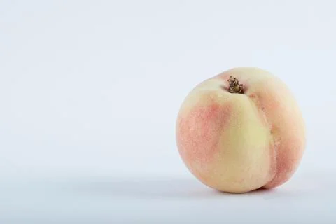 Single fresh peach located on white background Stock Photos