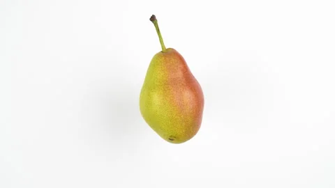 Single Fresh Pear Rotating On White Background Isolated Stock Footage 323587537