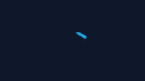 A single glowing blue light point isolated against a dark black background Stock Footage 339615287