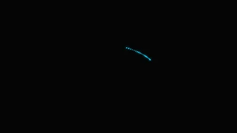 A single glowing blue light streak shimmering against a deep black background Stock-Footage 339617691