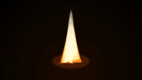 A single glowing candle flame isolated against a deep black background Video stock 335118036