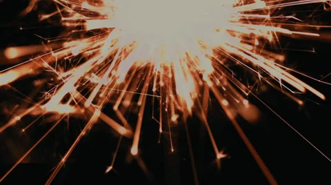 Single Gold Colored Sparkler burning close up Stock Footage 39415498