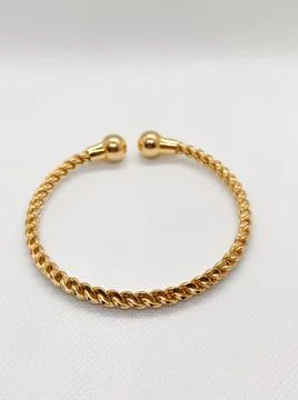 A Single Golden Bangle isolated White Background Stock Photos