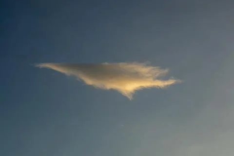 Single Golden Cloud Against Blue Sky Fotos Stock