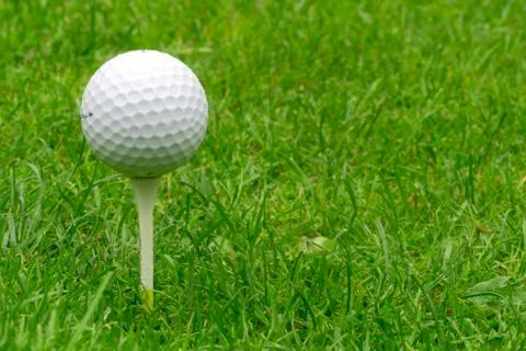 Single Golf Ball Balancing on a Tee Stock Photos