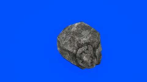 Single Gray Rock Floating Against a Solid Blue Screen Background Vídeo Stock 330919802