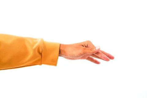 A single hand extends forward against a plain white backdrop in warm natura.. Stock-Fotos