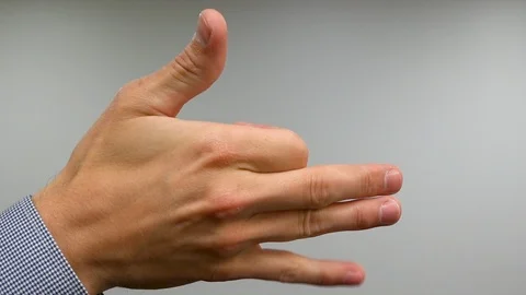 Single Hand Shadow Puppet of a Dog with Caucasian Middle-Aged Male Hand in Stock Footage 118438204