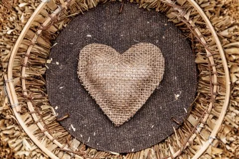 A single heart inside a basket Stock Photos
