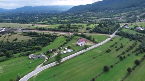A single-house centered footage in close to a small village in the mountains Stock Footage 194554202