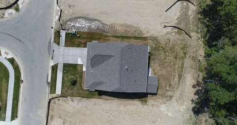 A single house on a plot of land, with neighbouring properties  drone aerial 4k Stock Footage 114140188