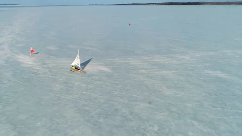 Single ice yacht taking the windward race mark at high speed Stock Footage 88201554