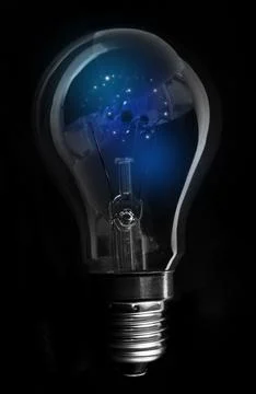 Single incandescent light bulb is glowing with blue filament in dark studio 3D Stock Photos