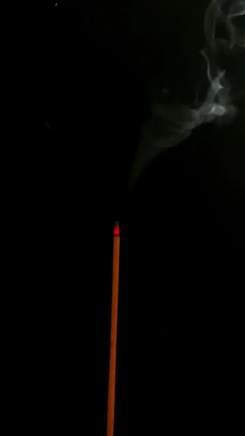 Single Incense Stick Burning with Smoke on Black Background Minimalist Video Stock Footage 330978155