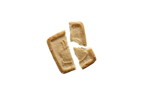 Single isolated broken biscuit in white background Fotos Stock