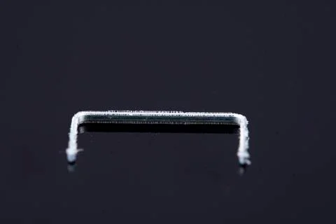 A single isolated tacker on a black background Foto stock