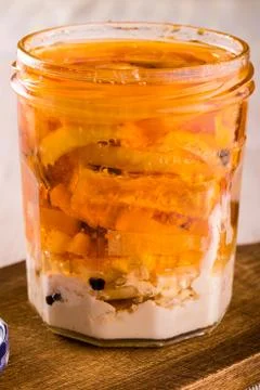 Single jar full of pickled cheese with onion Stock Photos
