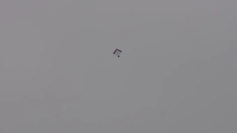 Single kite flying high in clear sky Stock Footage 320016439