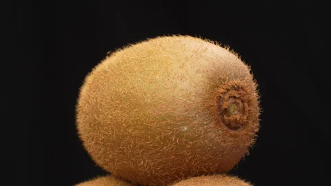 Single Kiwi Fruit Spinning 360 Loop Isolated on black Background Stock Footage 319914524
