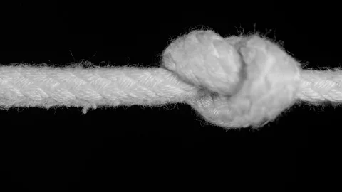 SINGLE KNOT IN ROPE.   IN 4K ECU MACRO SLIDER SHOT. Stock Footage 109415911