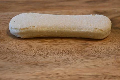 Single Ladyfinger Biscuit on Table Minimal Food Concept Copy Space Photos