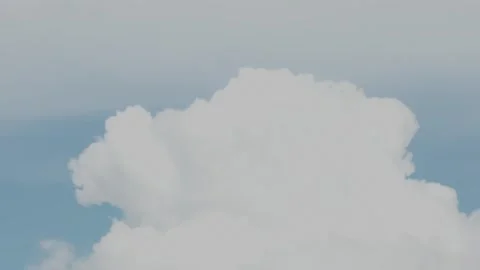 A single large fluffy white cloud against a blue sky. Stock Footage 342949676