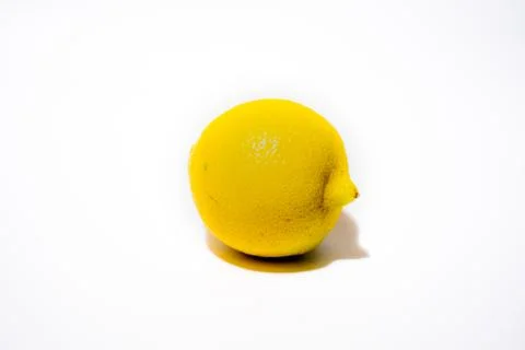 A single lemon on a white background. Stock Photos