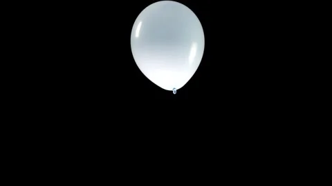 Single Light Blue Balloon Falling and Twisting Gracefully as It Descends Stock Footage 304490831