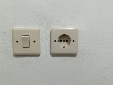 Single light switch and type C wall socket. Electrical equipment. Stock Photos