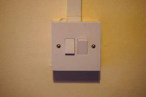 Single light switch on a white wall 写真素材