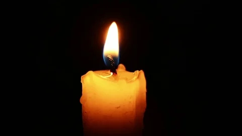 Single lit candle with quite flame Видео 84272620