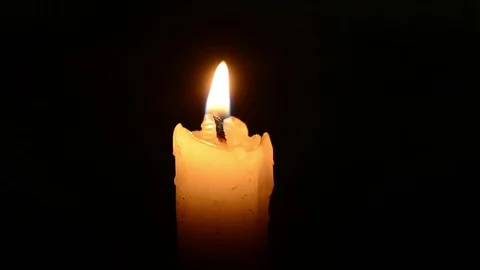 Single lit candle with quite flame Видео 84305253