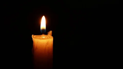 Single lit candle with quite flame Видео 84305359