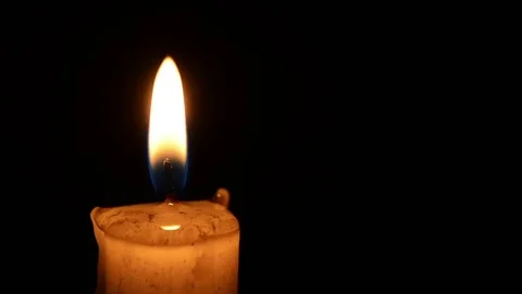 Single lit candle with quite flame Видео 84305799