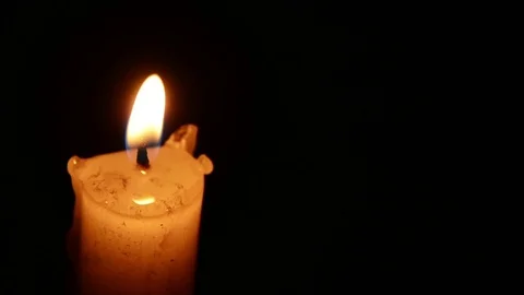 Single lit candle with quite flame Видео 84306703