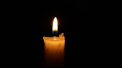 Single lit candle with quite flame Stock Footage 84307549