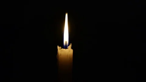 Single lit candle with quite flame Видео 84308920