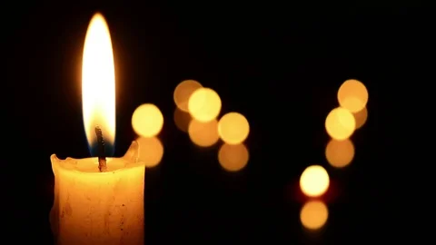 Single lit candle with quite flame Видео 84309489