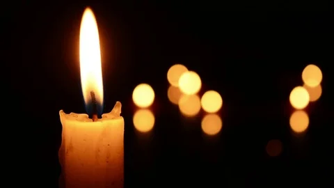 Single lit candle with quite flame Видео 84309602