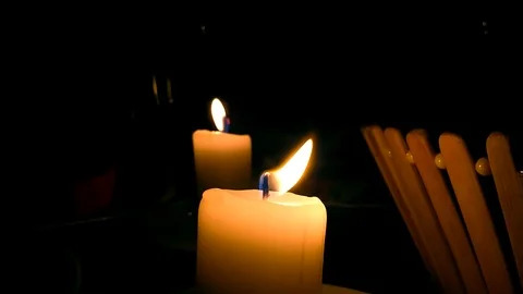 Single lit candles with quite flame Video stock 101034312