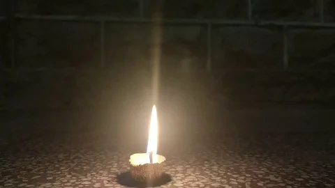 Single lit up Deepak in the night for celebrating Deepawali festival Stock Footage 118689950