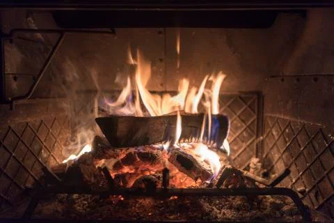 A single log inside of a wood burning stove 写真素材
