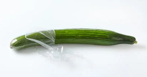 Single long cucumber Stock Photos