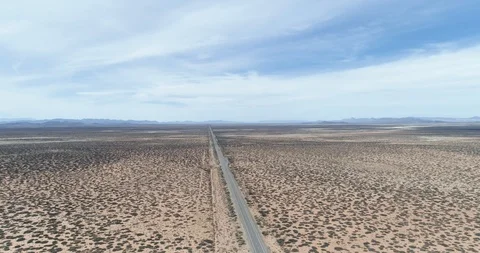 Single long straight road through deserted landscape drone aerial 4K Stock Footage 111313801